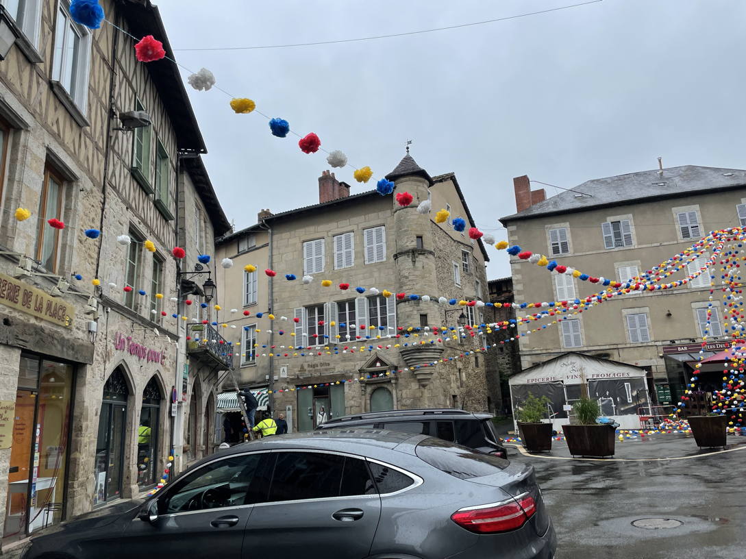 Workers on ladders, setting up street decorations