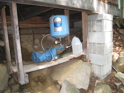water pump mounted under the cottage