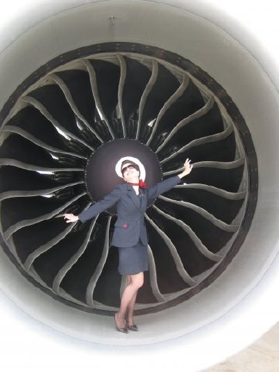 Rachael standing inside a huge jet engine